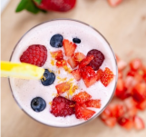 Smoothie with fresh fruit on the top